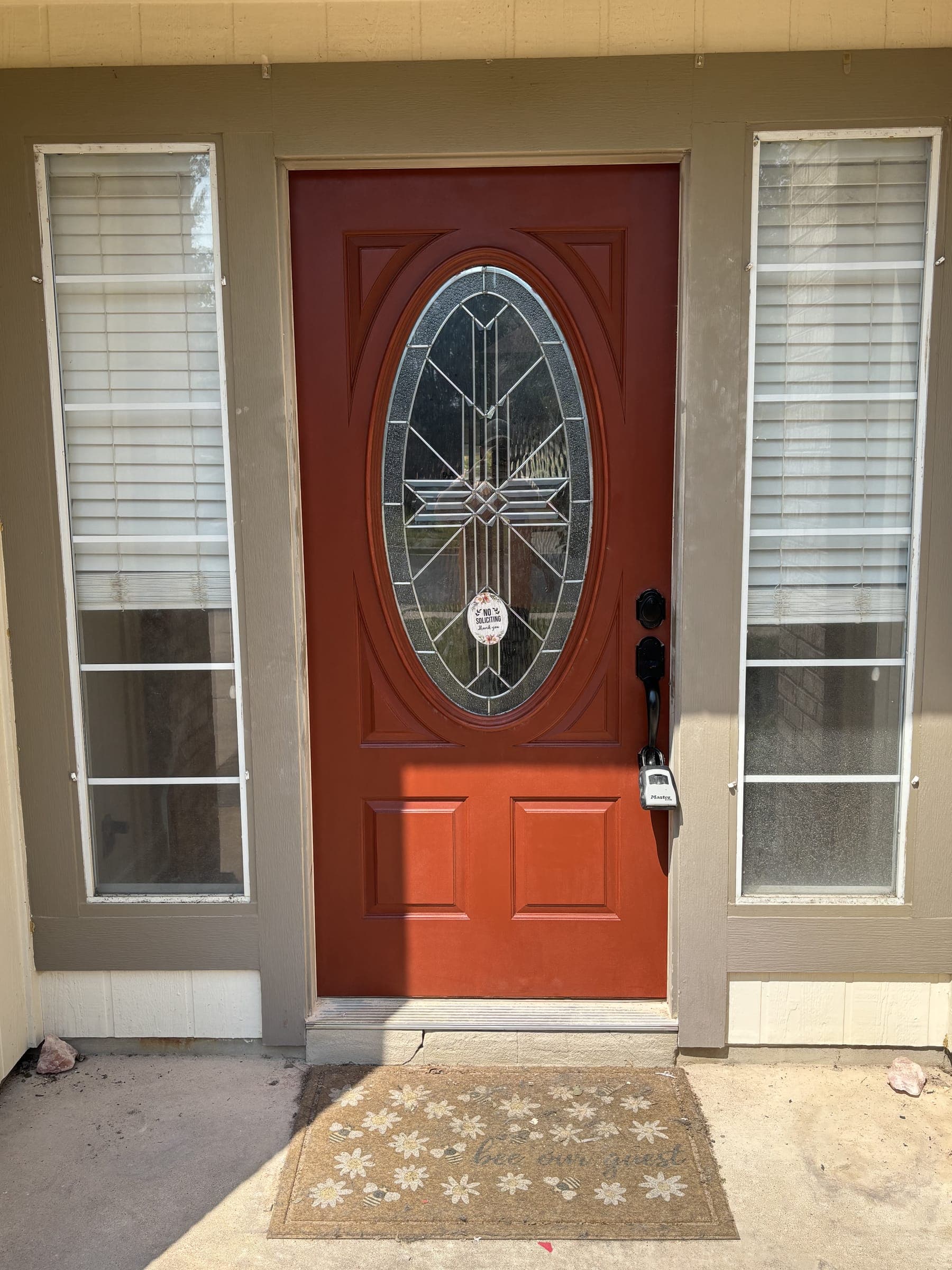 The same door refinished in a deep even red, leaded glass cleaned up